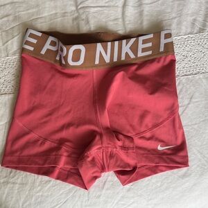 Nike  Pro Women's Athletic Shorts in Coral and Brown